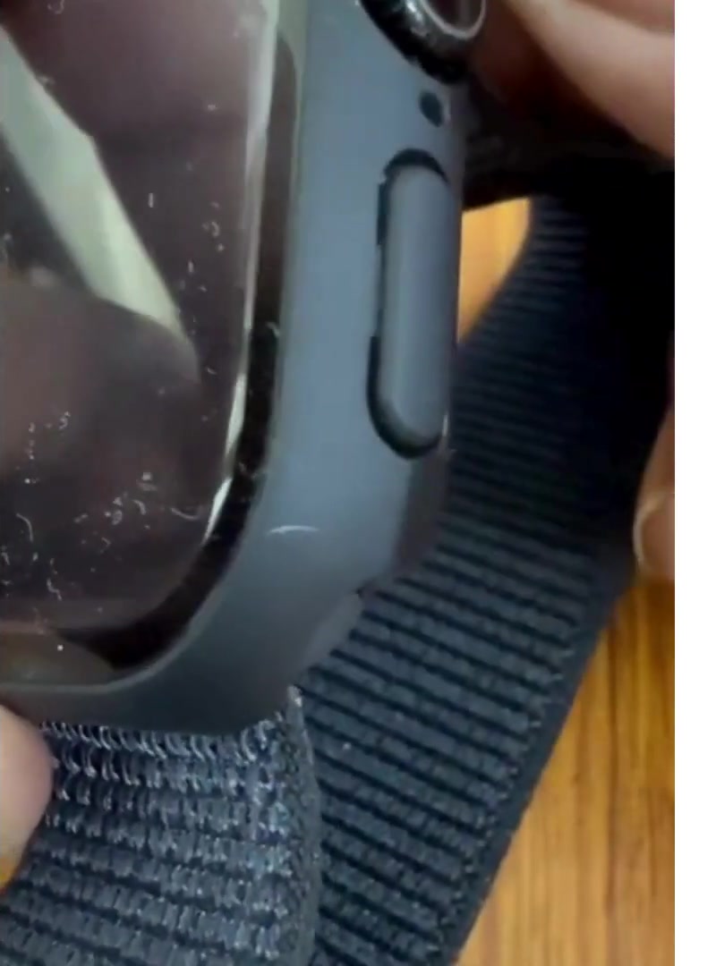 Close-up of the side of an Apple Watch showing the Digital Crown and the side button
