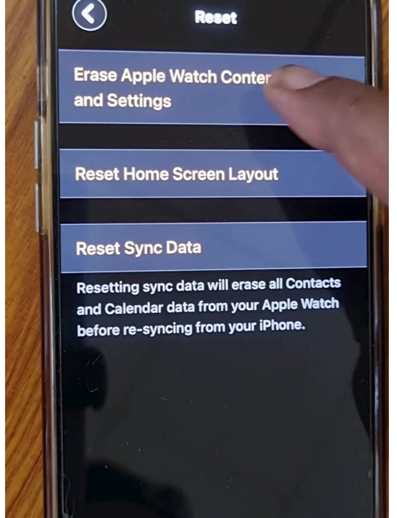 The Reset screen in the Apple Watch app showing Erase Apple Watch Content and Settings