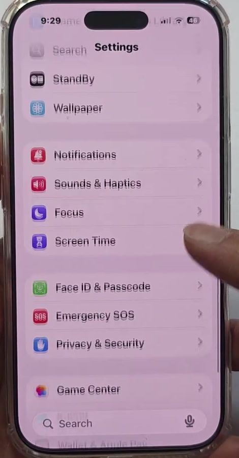 iPhone Settings list with Screen Time being tapped