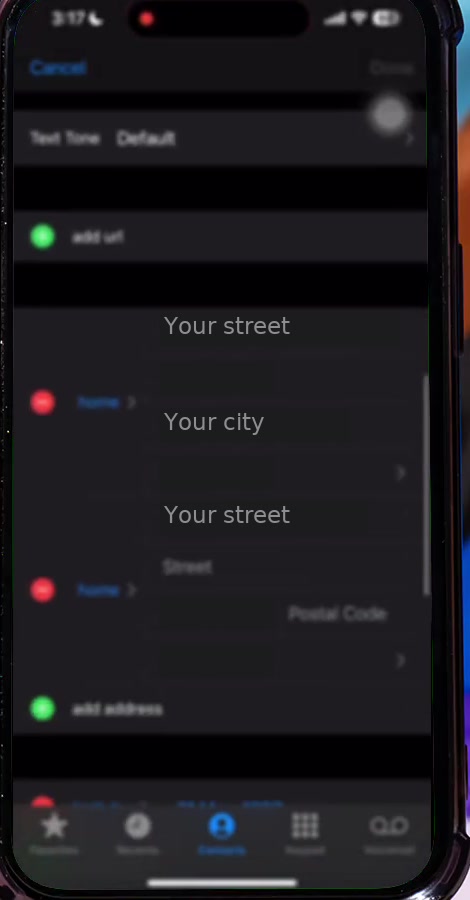 A contact card in edit mode in the iPhone Contacts app showing two address blocks and the add address row