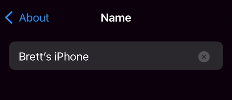 iPhone Name screen with the current device name and a clear button at the right of the field