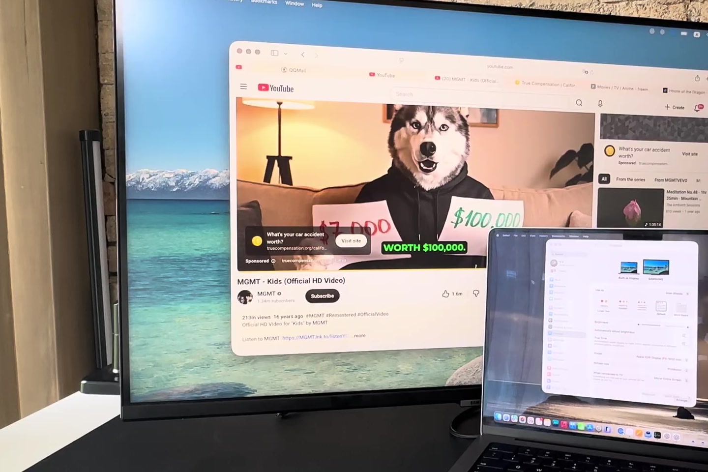 MacBook Pro connected by cable to a Samsung external monitor with the desktop extended across both screens