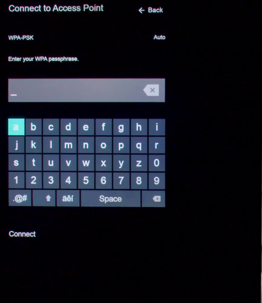 Vizio Connect to Access Point screen showing the WPA passphrase field, the on-screen keyboard with letters, numbers and symbol keys, and the Connect option below