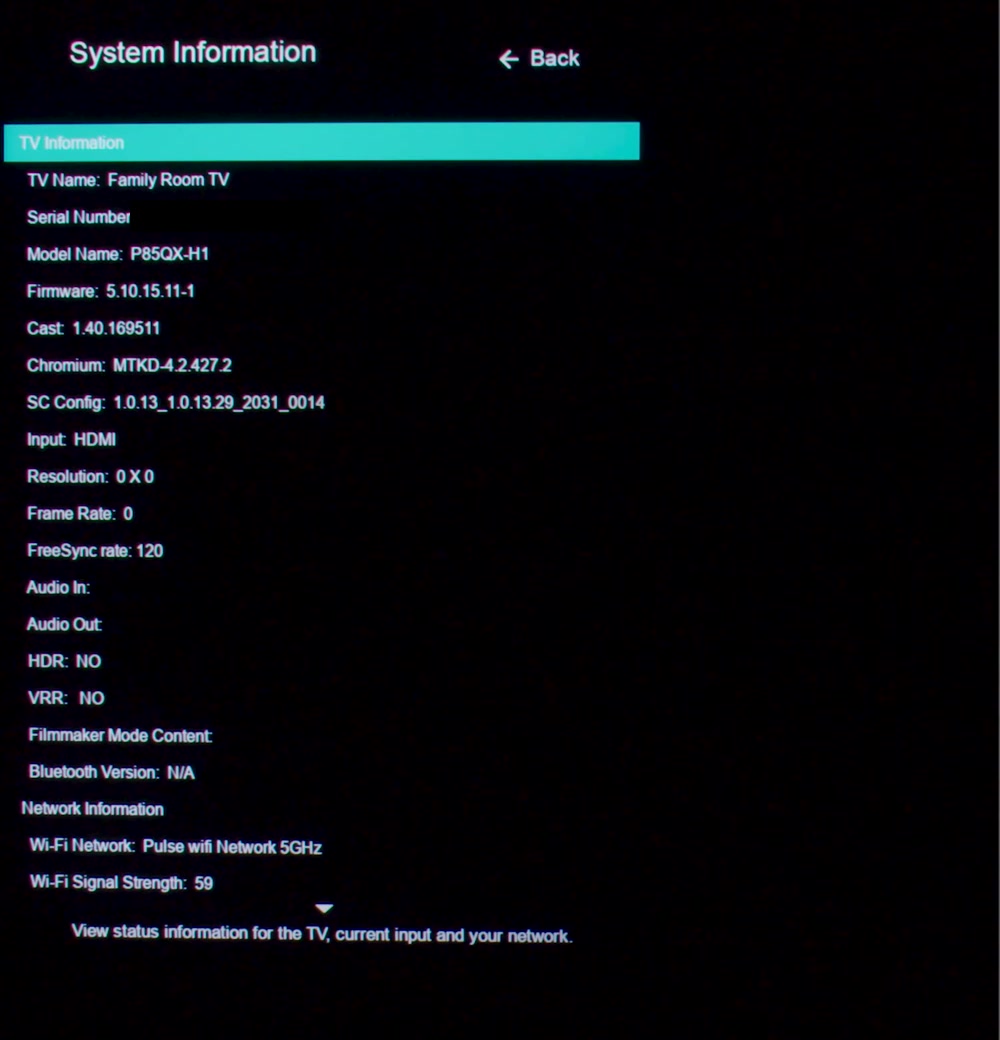 Vizio System Information screen with the Network Information section at the bottom showing the connected WiFi network name and a WiFi signal strength value; the serial number has been blacked out