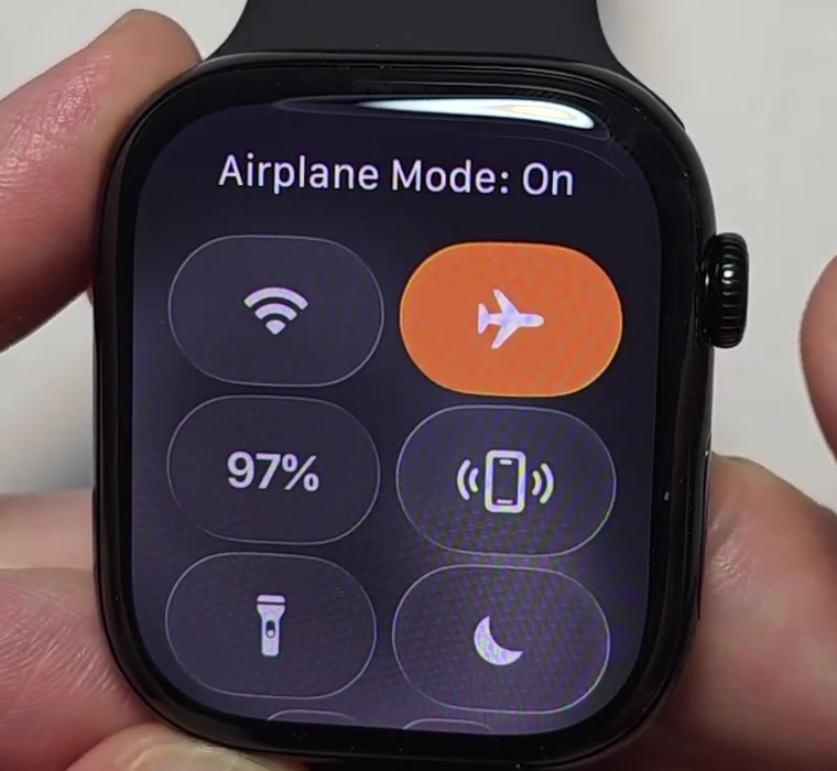 Apple Watch Control Center with the Airplane Mode button turned orange and the label Airplane Mode: On at the top