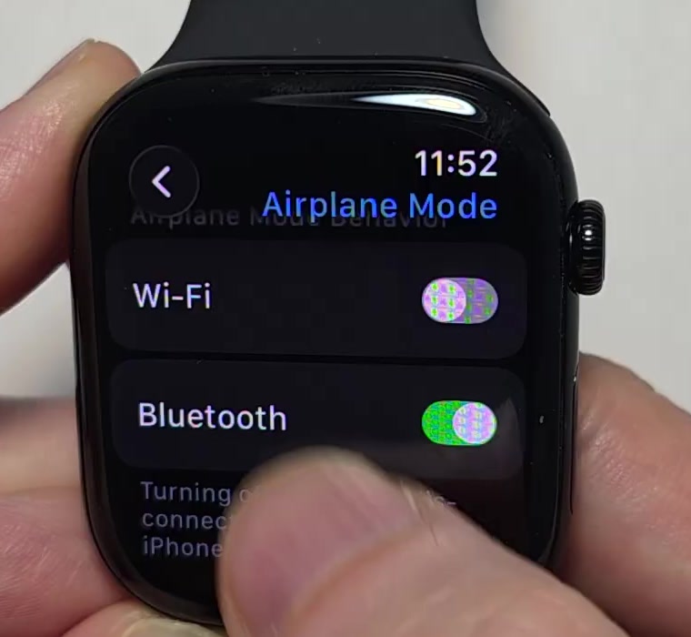 A finger tapping the Bluetooth switch on the Apple Watch Airplane Mode settings screen