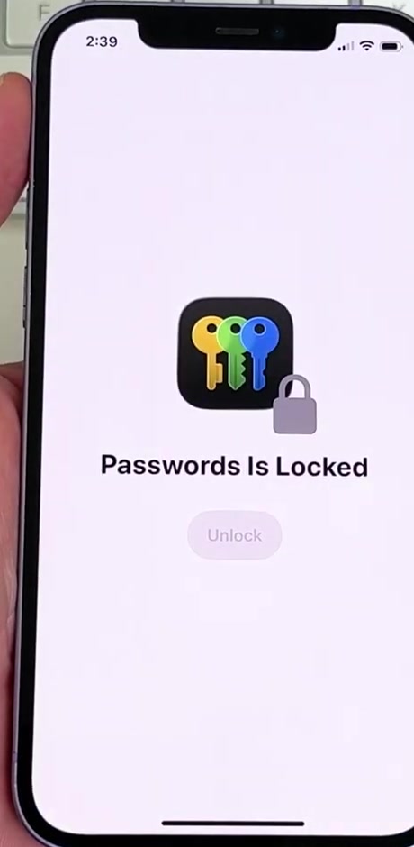 The Passwords app showing a Passwords Is Locked screen with an Unlock button