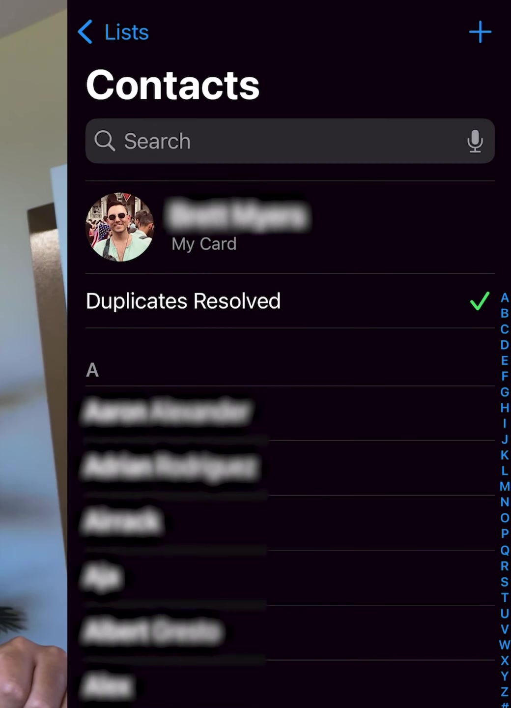 Contacts list showing a Duplicates Resolved confirmation with a checkmark in place of the duplicates banner