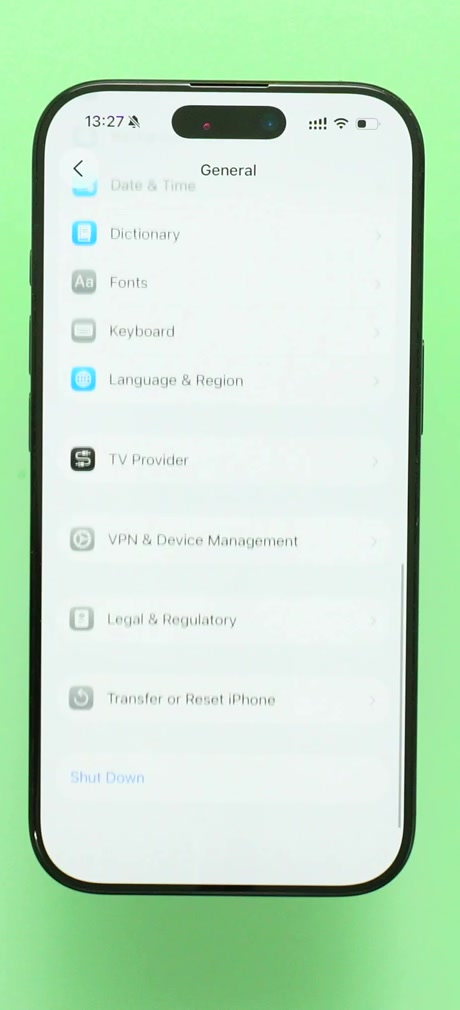 The General screen in iOS Settings with Transfer or Reset iPhone at the bottom of the list
