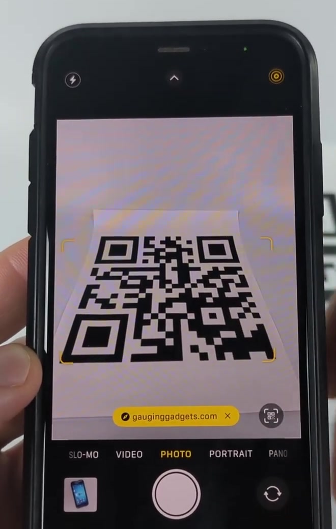 Yellow link banner appearing at the bottom of the iPhone camera viewfinder after a QR code is detected