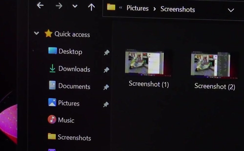 File Explorer open at the Pictures Screenshots folder showing files named Screenshot (1) and Screenshot (2)
