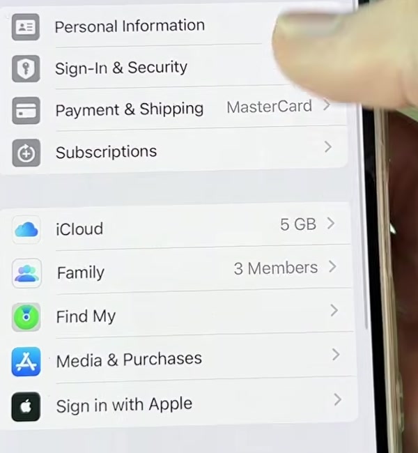 Apple Account screen on iPhone showing Personal Information, Sign-In and Security, Payment and Shipping, Subscriptions, iCloud, Family, Find My and Media and Purchases