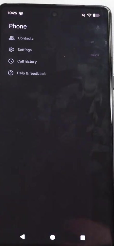 The More menu in the Google Phone app showing Contacts, Settings, Call history and Help and feedback