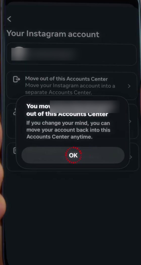 Confirmation message saying the account was moved out of this Accounts Center, with an OK button