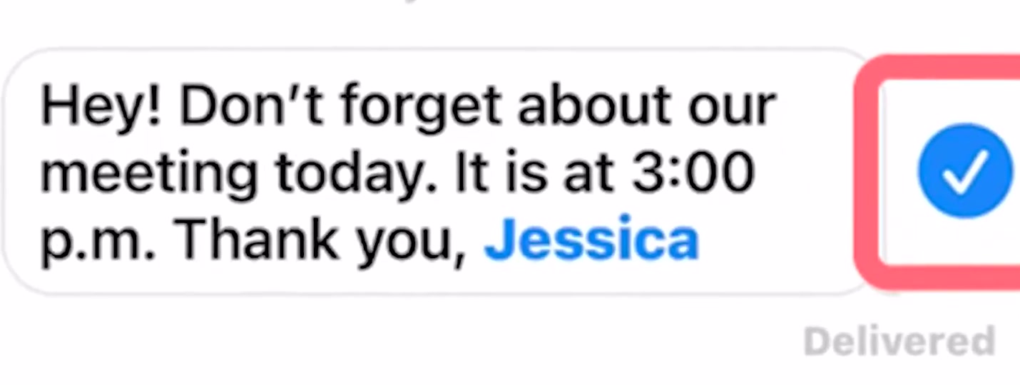 An iPhone message open for editing with the blue checkmark button used to confirm the change