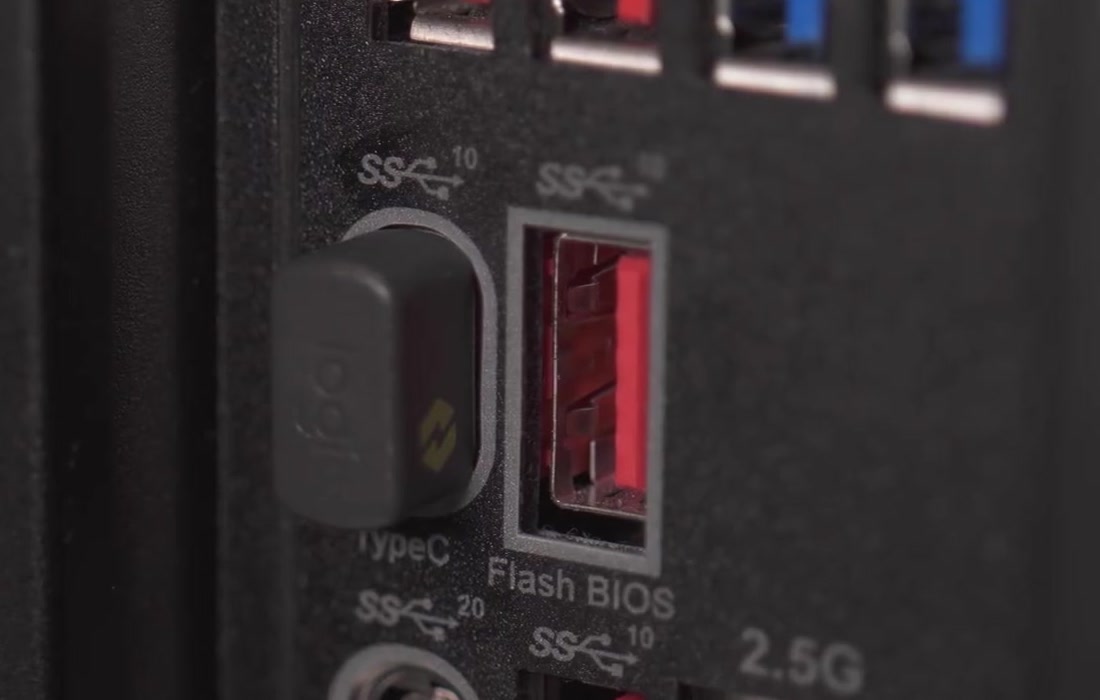 A Logitech receiver plugged directly into a USB port on the rear panel of a desktop PC