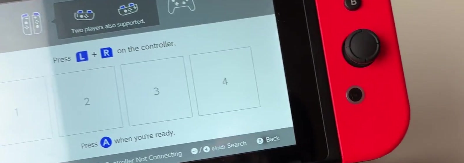 Switch Change Grip and Order screen prompting Press L + R on the controller with four numbered player slots